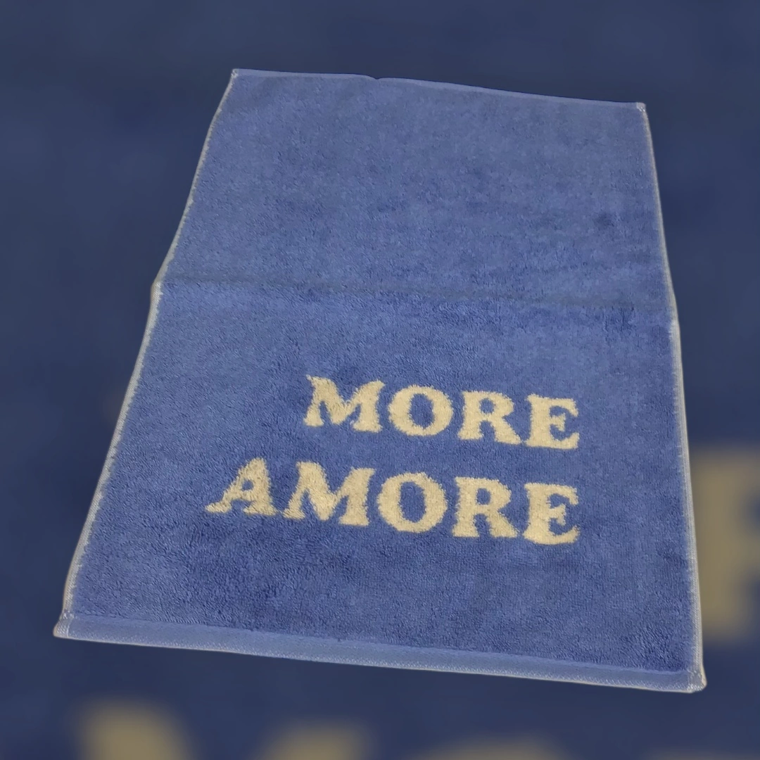 blaues Gästetuch von Cawö mit Schriftzug More Amore in Beige